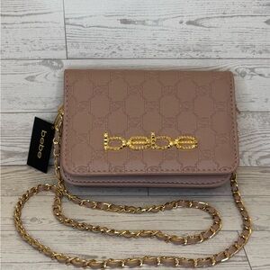 Bebe Celia Monogram Mauve Flap Crossbody Bag.
